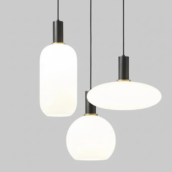 hero Three modern pendant lights hanging against a neutral background
