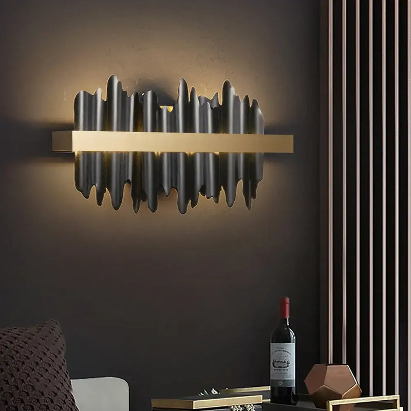 Striking Black and Gold Wall Lamp illuminating a modern interior with up & down lighting effect.