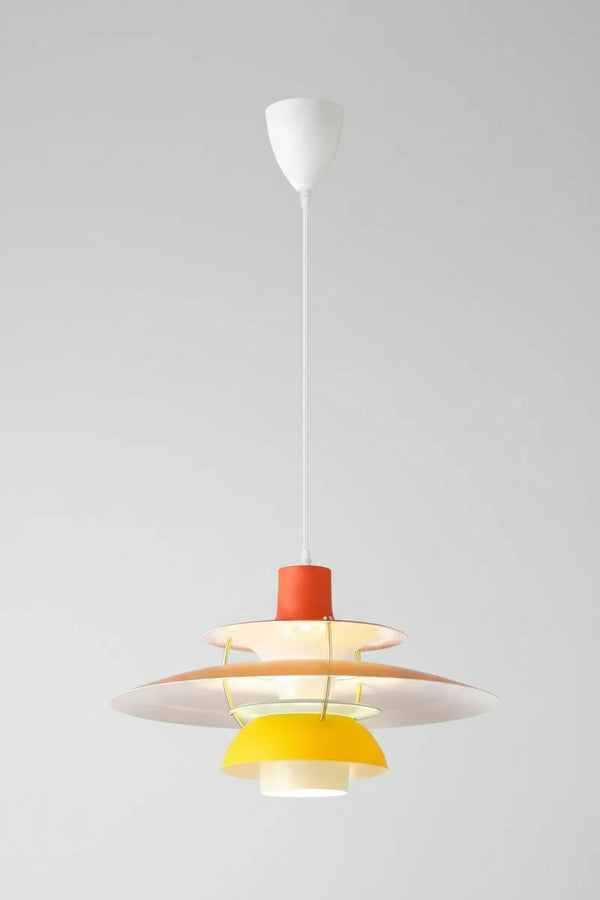 Hero A modern multi-tiered pendant light fixture with a white ceiling canopy and cord, featuring white, beige, orange, and yellow concentric shades.