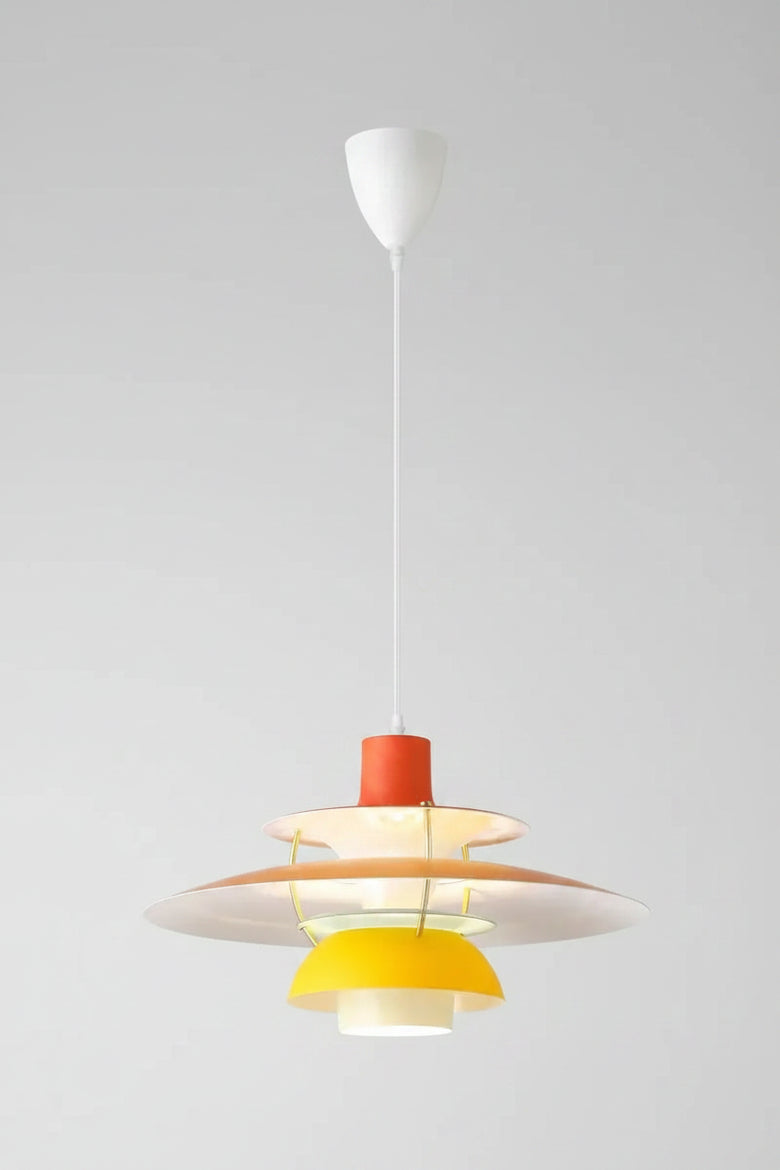 Hero A modern multi-tiered pendant light fixture with a white ceiling canopy and cord, featuring white, beige, orange, and yellow concentric shades.