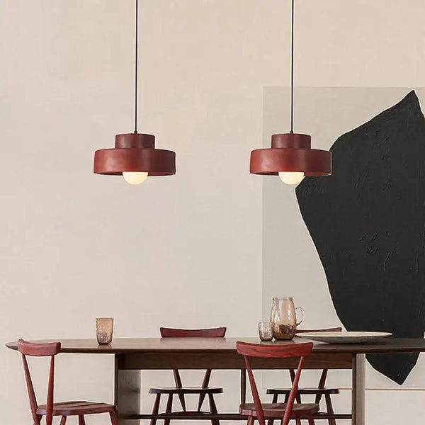 Illuminate Your Space with the Minimalist Nordic Resin Pendant Light illuminating a dining table.