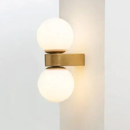 Chic Dual Bubble Wall Light - Modern & Versatile Lighting with polished brass and round glass shades