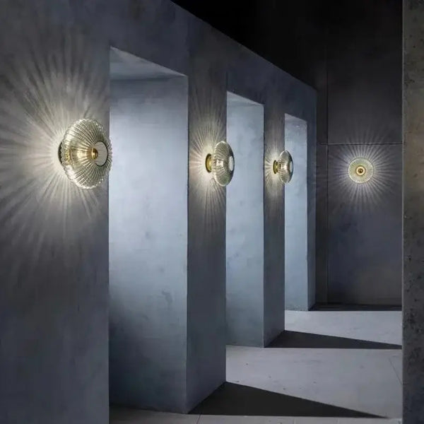 Radiant Modern Glass Wall Lamp illuminating a stylish interior corridor with captivating light patterns.