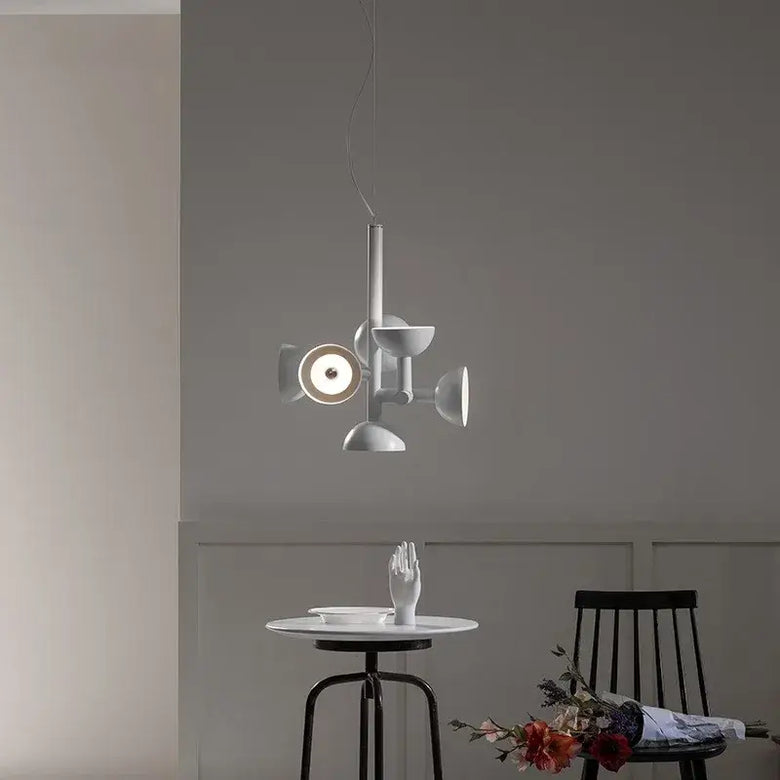 Danish Postmodern LED Chandelier – Sculptural Black Designer Pendant Light illuminating a dining table in a modern interior.