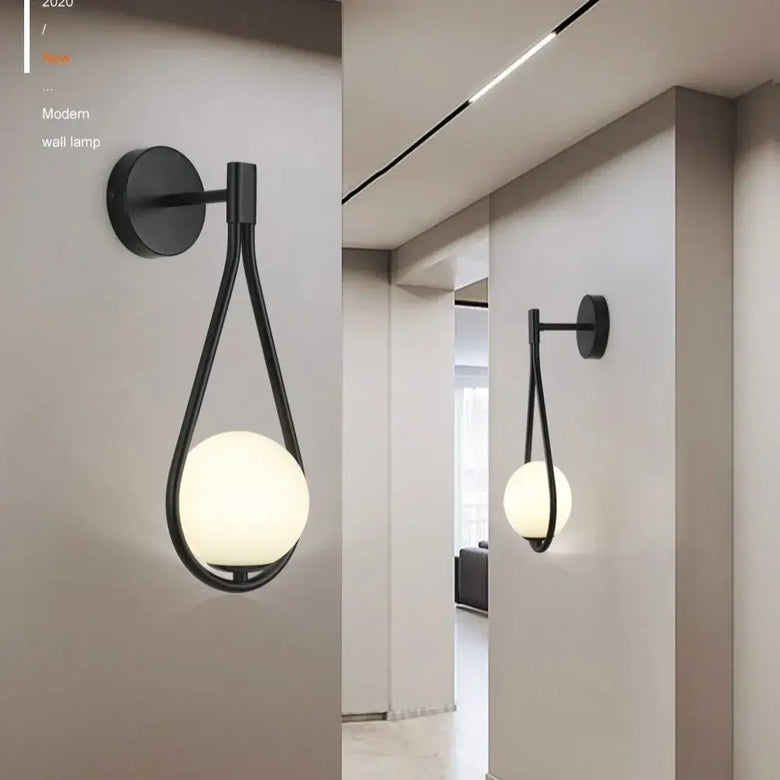 Drop Luxury Glass Ball Wall lamp in a modern setting with sleek design and minimalist glass ball.