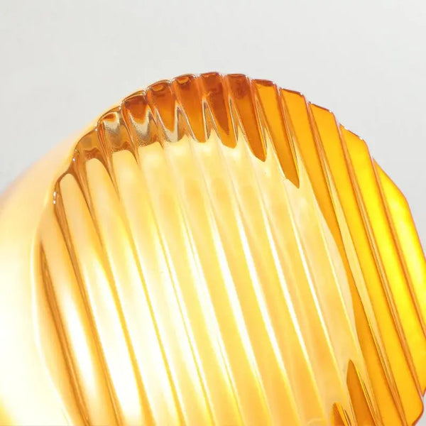 Futuristic and Unique Solid Plexiglass Wall Light in fluted design showcasing captivating amber hue.