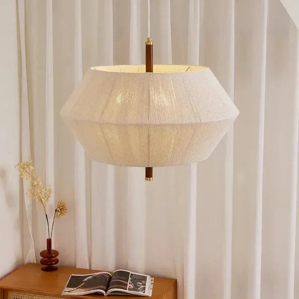 Japanese Retro Woven Fabric Chandelier hanging elegantly in a modern interior with white curtains.