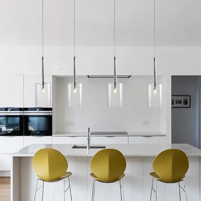 Neo Transparent Scandinavian Light Fixture in a modern kitchen with yellow stools.