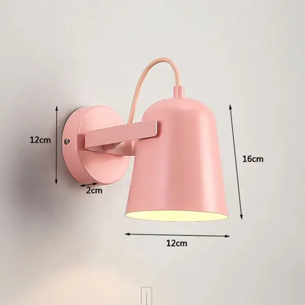 Nordic Bell Bedside Wall Lamp in pink with adjustable shade and sturdy metal construction.