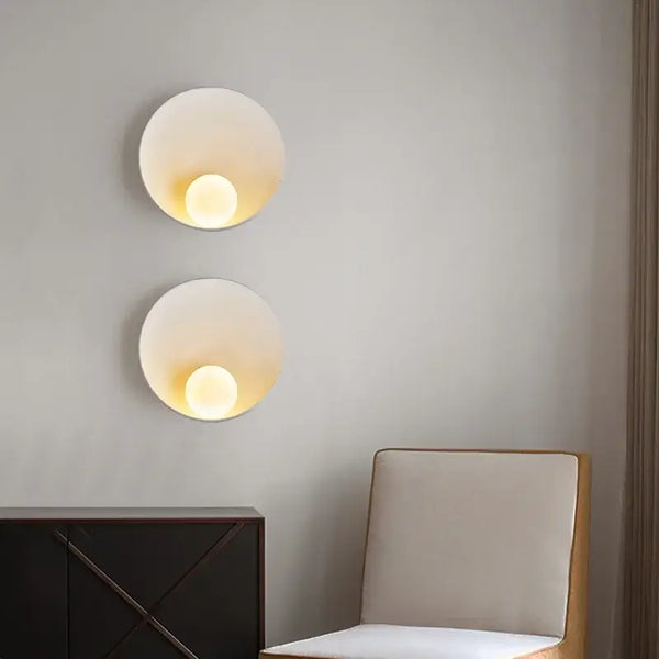 Sleek Resin Wall-Mounted Bathroom Light with frosted glass, illuminating a modern interior space.