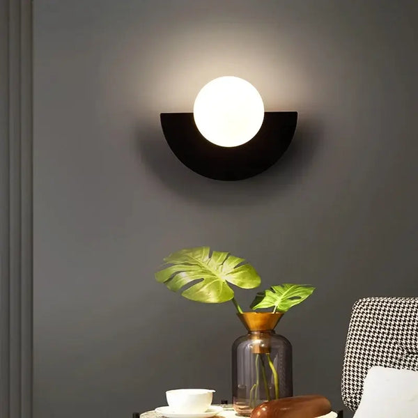 Halfmoon Metal Sconce. Comes in 2 different sizes and various colours. Modern Nordic design with clear glass shade.