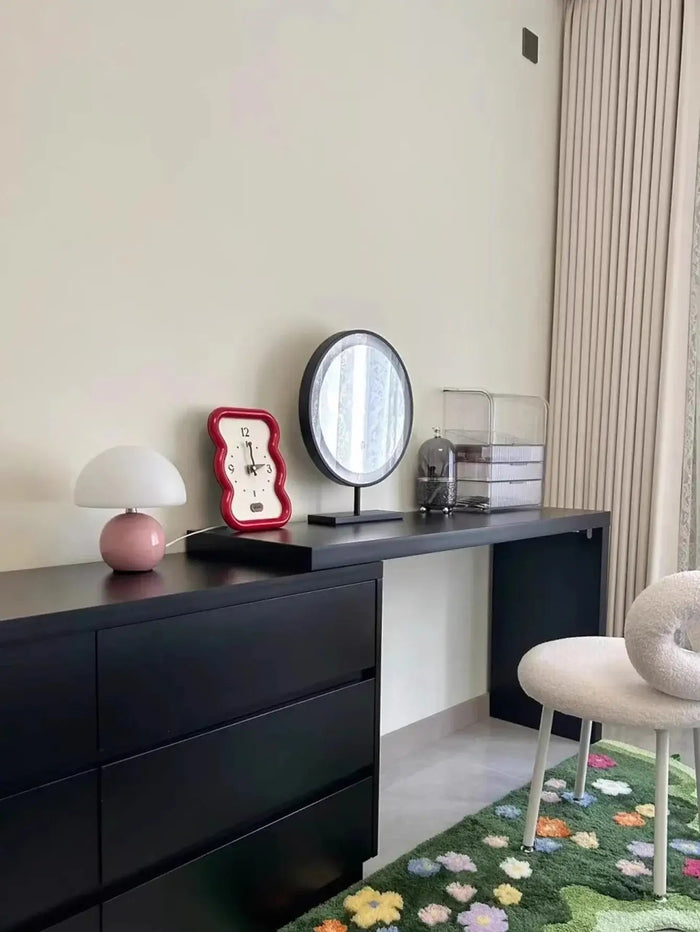 Mushroom LED USB Table Lamp in Pink – Soft Glow Bedside Lighting on a modern black dresser, adding charm and warmth.