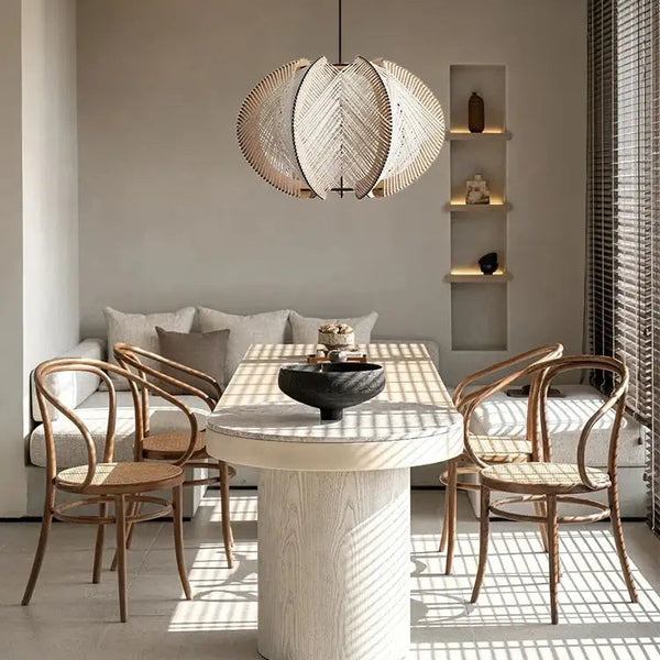 Nordic Spider Web Pendant Light inspired by the 70s! illuminating a modern dining space with rustic decor.