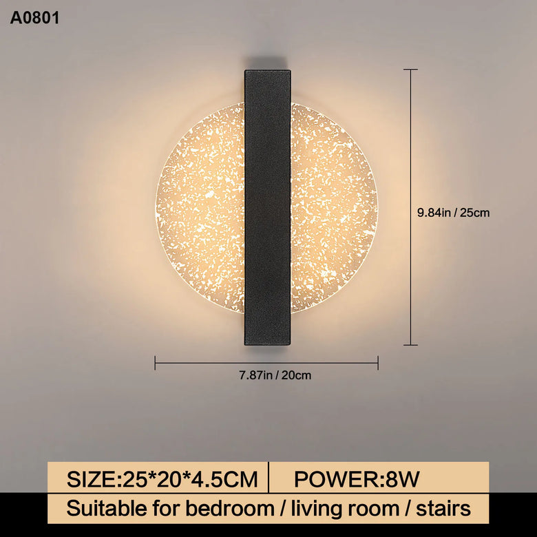 A modern wall sconce with a circular textured glass shade and a vertical matte black metal bar, shown with dimension markings (7.87 in width and 9.