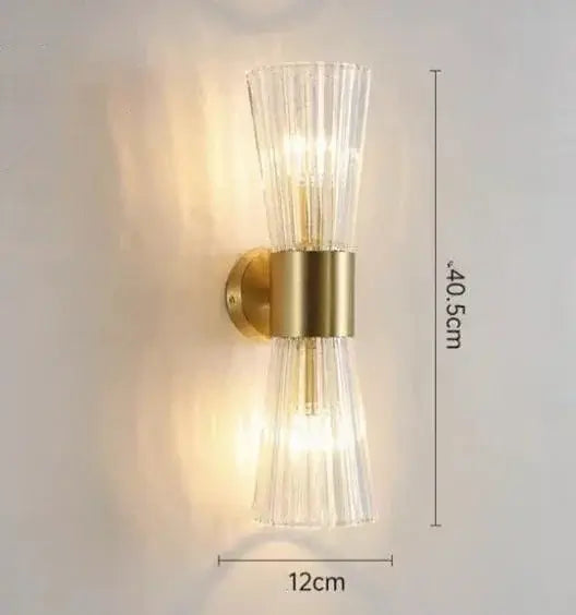 Unique Collection of Art Deco Sconces featuring a stylish glass design and brass accents, ideal for modern interiors.