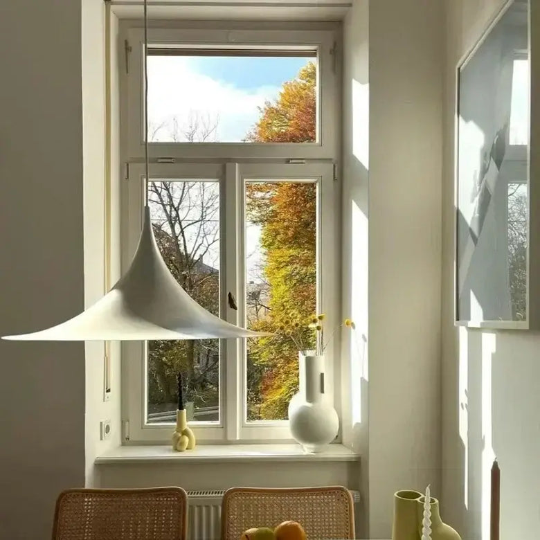 Scandi 70s Danish Pendant Lamp – Minimalist Metal LED Chandelier for Dining & Living Spaces illuminating a modern dining area.