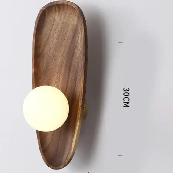 Vintage Walnut Wall Light featuring a sleek walnut wood base and frosted glass orb, perfect for a vintage home decor aesthetic.