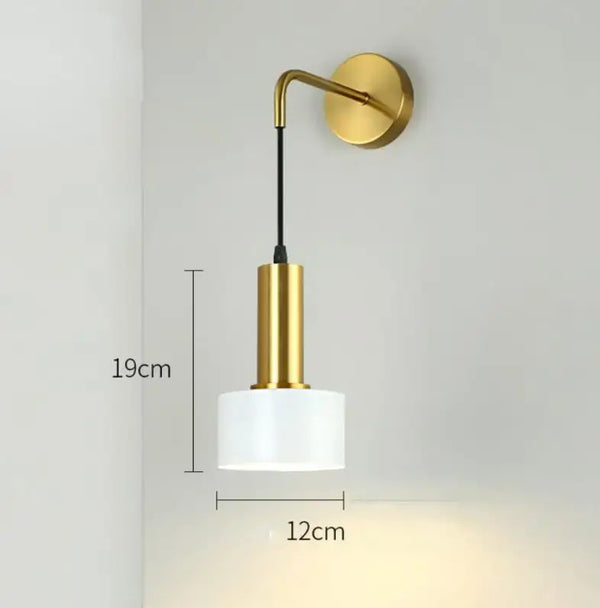 Gold Wall Mounted Spot in Brass and Black Colours, featuring a sleek gold design with a glass shade, ideal for modern interiors.