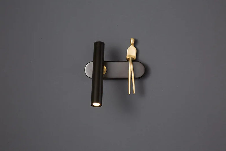 Minimalist Wall mounted Light with Seated human figure, Gold/Black