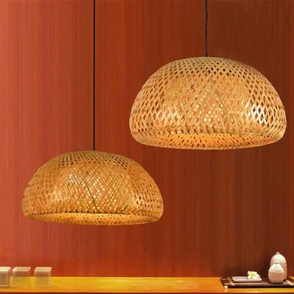 Chic Mid-Century Rattan Chandeliers hanging over a wooden surface, featuring woven rattan design and soft patterned light.