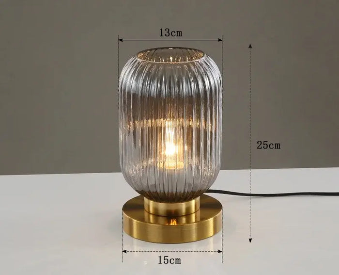 Modern Nordic Glass Table Lighting Fixtures featuring elegant glass design and gold base, adding sophistication to any decor.