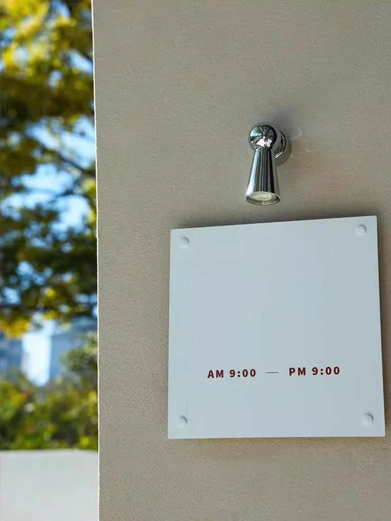 Applique murale chromée avec bras réglable