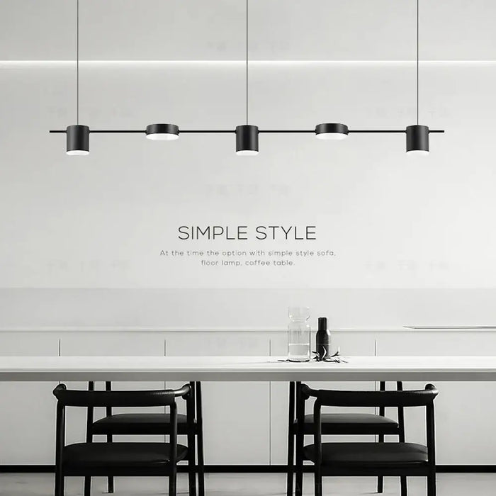 Hanging Minimalism Lights showcasing a stylish and modern design over a dining table in a contemporary setting.