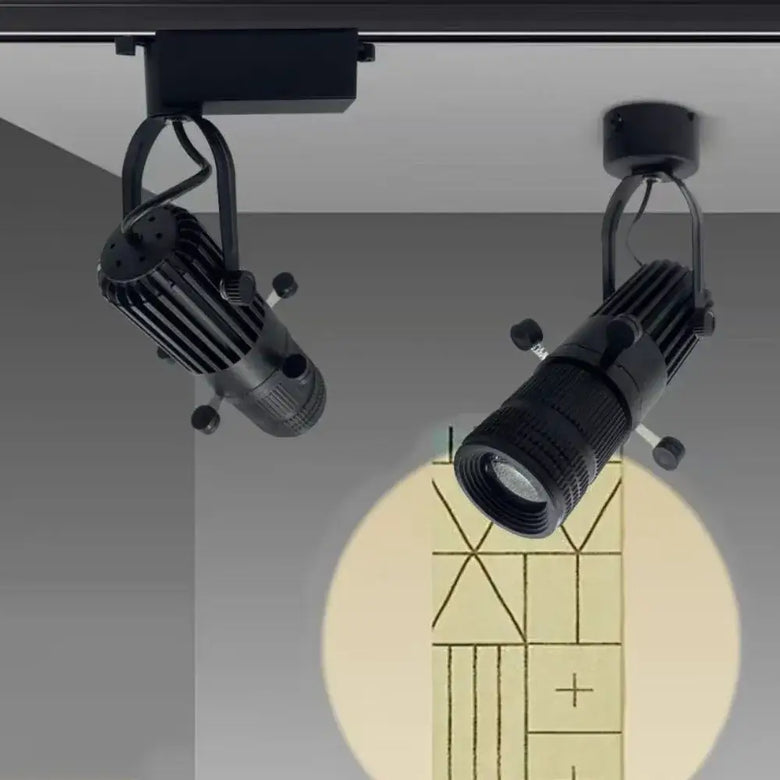 Rotatable adjustable LED spotlight with 360-degree rotation illuminating a wall design.