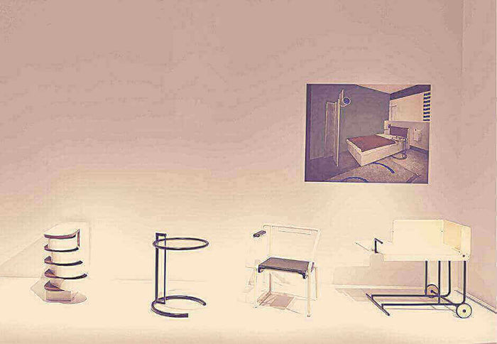 Elements of Eileen Gray's Style showcasing iconic furniture designs.
