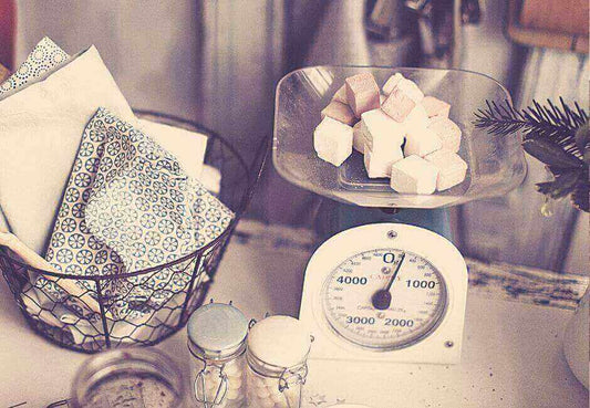 Traditional scale used for baking illustrating benefits vs electronic scales - What are the benefits of using electronic scales vs traditional scales when baking - Updated for 2023