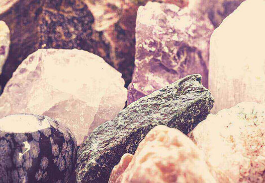 The 2023 Nauradika How to Guide: Decorating with Natural Gems image featuring a collection of colorful gemstones for decor.