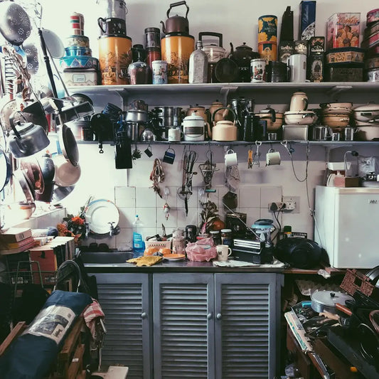 What are the pros and cons of open shelving versus closed cabinetry