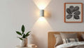 Rechargeable Wall Lights: The Flexible Solution for Modern Interior Design in 2026, enhancing a stylish bedroom with soft illumination.