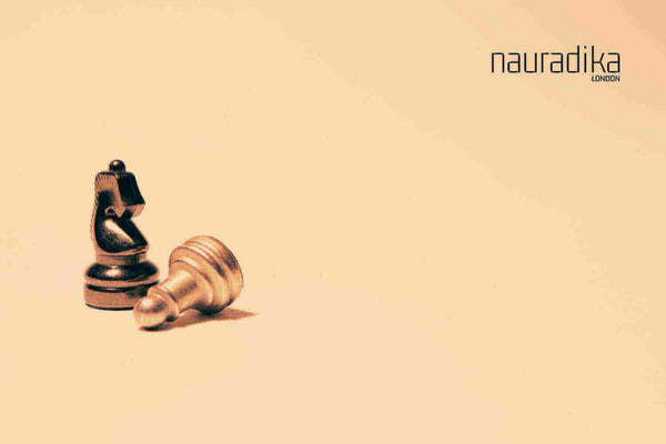 Minimalist chess pieces from Nauradika's collection, illustrating article on how to set up a chess board.