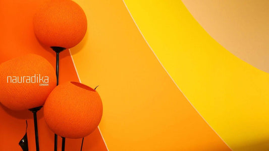 70s interior decor? Need we say more? Vibrant orange and yellow color scheme with spherical lighting fixture.