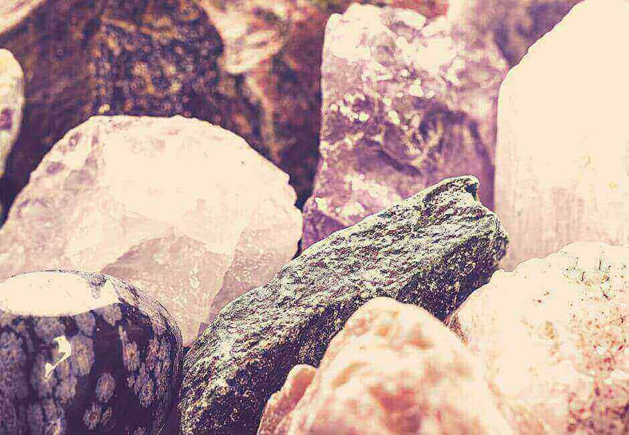 The 2023 Nauradika How to Guide: Decorating with Natural Gems image featuring a collection of colorful gemstones for decor.