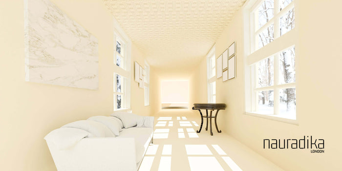 Bright monochromatic room showcasing the use of a monochromatic color scheme in interior design with white and cream elements.