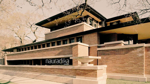 How has Frank Lloyd Wright influenced interior design (updated in 2023)? Iconic architectural design exemplifying his principles.