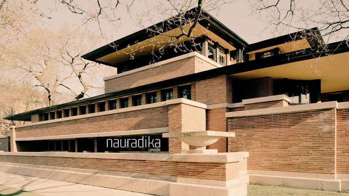 How has Frank Lloyd Wright influenced interior design (updated in 2023)? Iconic architectural design exemplifying his principles.