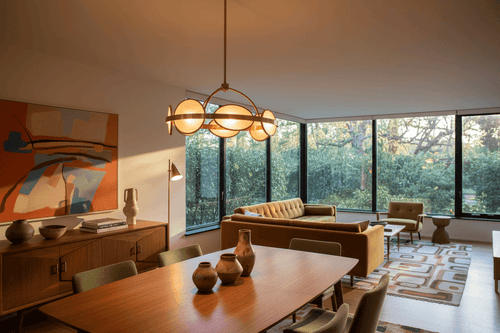 Statement Lighting: How One Fixture Transforms a Room with a stylish pendant light in a modern living space.