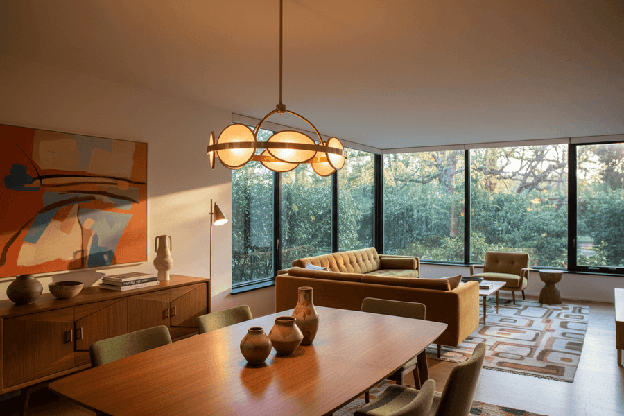 Statement Lighting: How One Fixture Transforms a Room with a stylish pendant light in a modern living space.