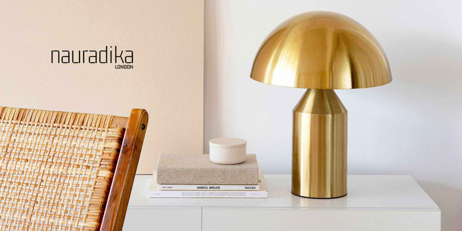 Modern interior decor featuring a golden lamp and books on a minimalist white table - Don't overcrowd your interior