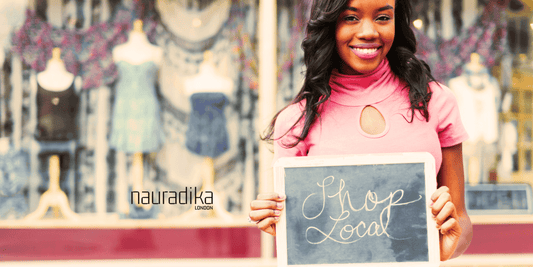 The Benefits of Shopping Small and Supporting Local Businesses - Woman with 'Shop Local' sign
