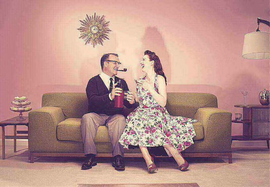 Vintage couple in kitsch style living room, showcasing top 10 reasons to love the Kitsch style in house decoration.