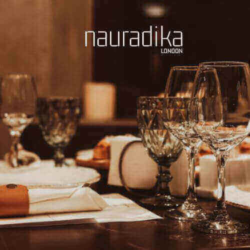 Elegant dining table setup showcasing how to use glassware to impress your guests with style and sophistication.