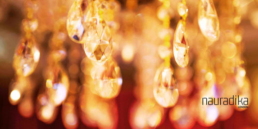 Antique and Vintage Lighting Options, crystal chandelier droplets with warm golden ambiance, adding elegance and charm to interiors.