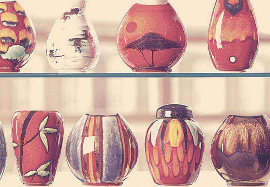 Top 5 most famous patterns by the Poole Pottery in Dorset, showcasing iconic designs with vibrant colors and unique motifs.