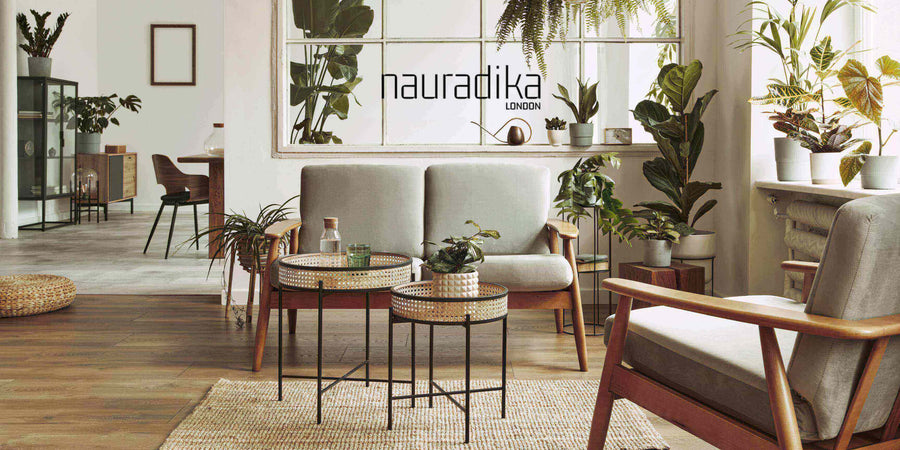 Modern living room showcasing use a variety of seating options in interior design with plants and natural light.