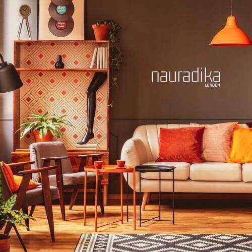 Use of orange in interior design with a stylish living room featuring orange accents, cushions, and a retro aesthetic.