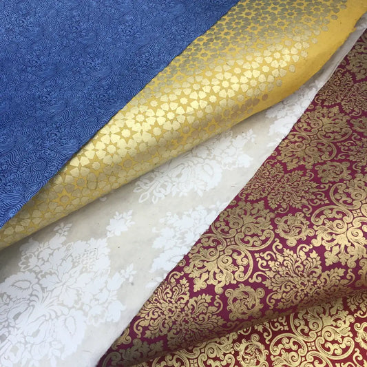 How do I effectively combine different fabrics in my interior design